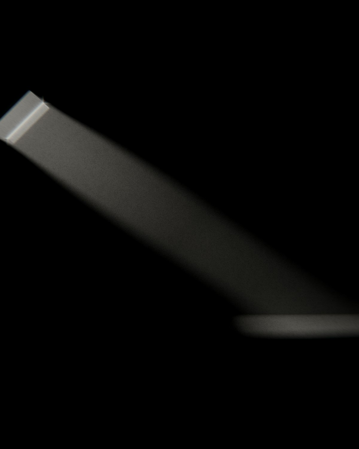 The Water Room: a single band of daylight falling from the roof slot to the floor.